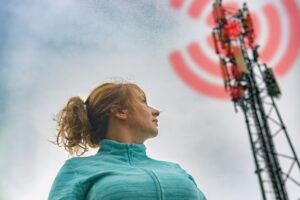 woman standing near harmful a radiation from cellular transmitters